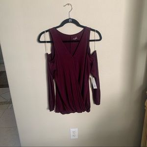NWT Plum Shoulder Cut Off Blouse by Francesca. Size Small. Brand new!